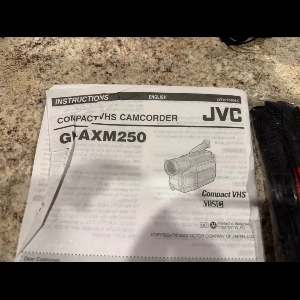 JVC Gray Camcorder with VHS-C Tapes